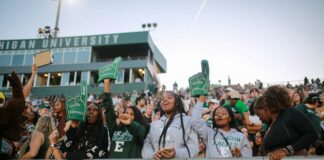 students at football game