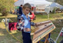 Young Folk Musician Performs at Local Events and Festivals
